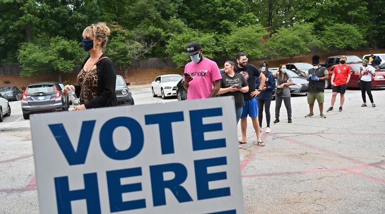 June 9, 2020 Decatur - DeKalb County residents wait outside Ray Hope Christian Church in Decatur to cast their votes after 7 p.m., original poll closing time, during the Georgia primary elections on Tuesday night, June 9, 2020.  Ray Hope Christian Church near Decatur will remain open until 10:10 p.m. (Hyosub Shin / Hyosub.Shin@ajc.com)