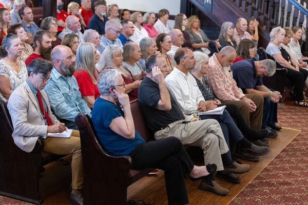 Residents, including plaintiffs in the front row, sit at a court hearing over attorney fees in lawsuits against Rivian’s planned electric vehicle factory on Wednesday, Aug. 13, 2025, at the Morgan County Courthouse in Madison. (Arvin Temkar/AJC)