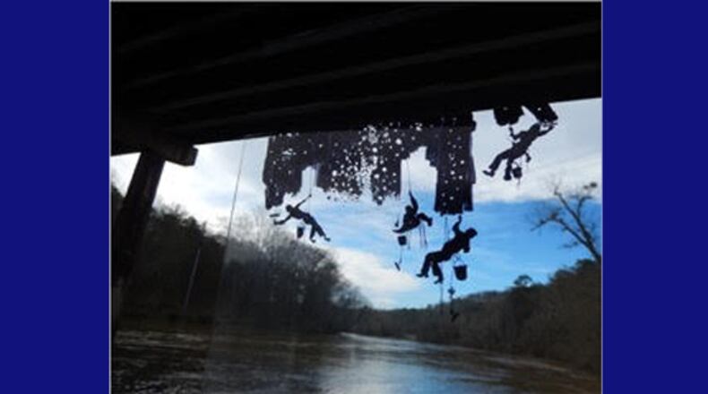 Photo illustration depicts “Sky Maintenance” as it will appear suspended from the Ga. 400 bridge over the Chattahoochee River in Roswell. ROSWELL ARTS FUND