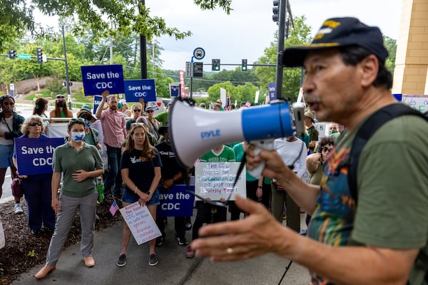 Konrad Hayashi speaks at last month's rally in protest of President Donald Trump’s proposed cuts to health services outside of the Centers for Disease Control and Prevention headquarters in Atlanta.