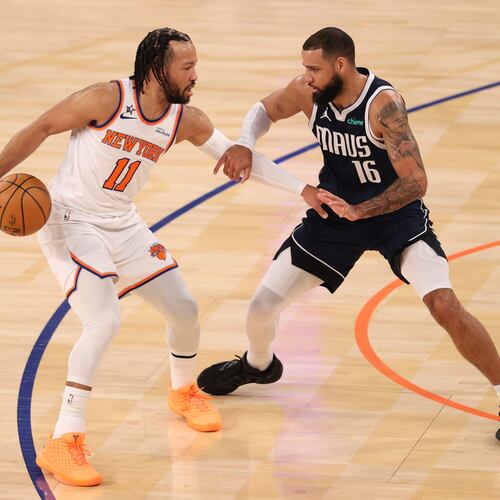 New York Knicks' Jalen Brunson (11) defends the ball from Dallas Mavericks' Caleb Martin (16) during the first half of an NBA basketball game, Monday, Jan. 19, 2026, in New York. (AP Photo/Pamela Smith)