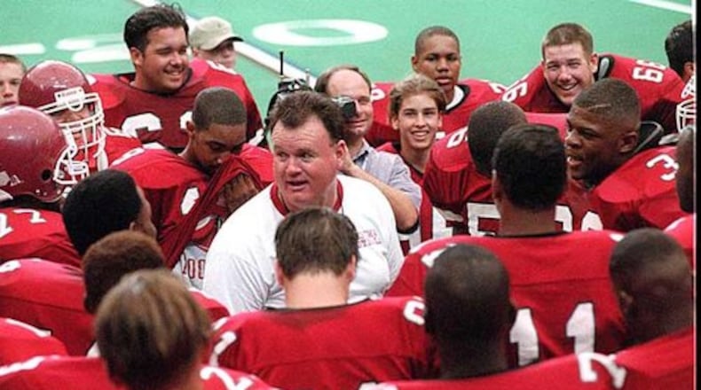 Robert Davis (center) won 354 games and three state titles as a Georgia high school football coach.