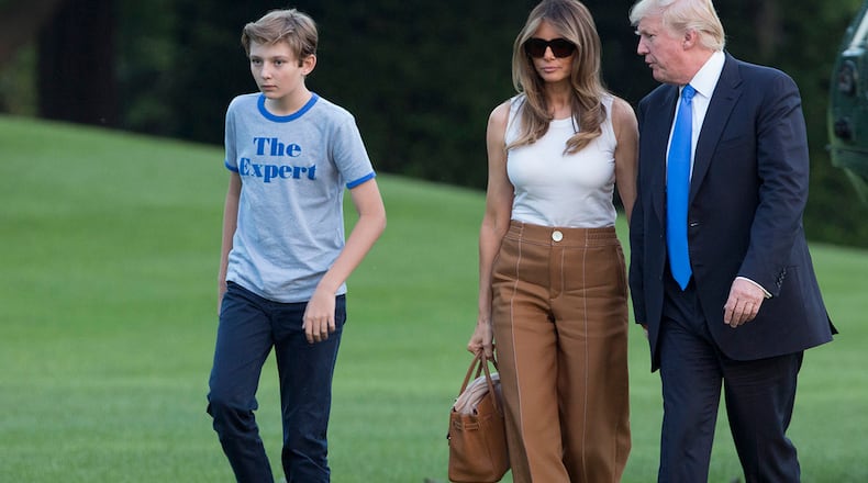 WASHINGTON, D.C. - JUNE 11: (AFP-OUT) U.S. President Donald Trump, first lady Melania Trump and their son Barron Trump arrive at the White House June 11, 2017 in Washington, DC. According to reports, Melania and Barron will soon be moving from Trump Tower in New York City to the White House. (Photo by Chris Kleponis-Pool/Getty Images)