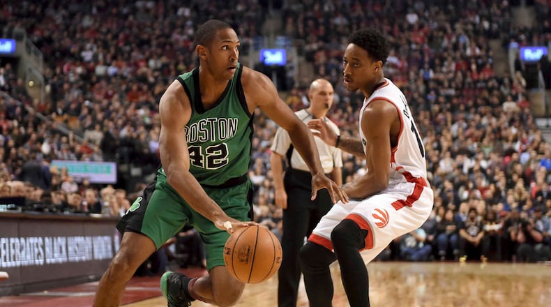Boston Celtics’ Al Horford (42) drives past Toronto Raptors’ DeMar DeRozan during the first half of an NBA basketball game Friday, Feb. 24, 2017, in Toronto. /The Canadian Press via AP)
