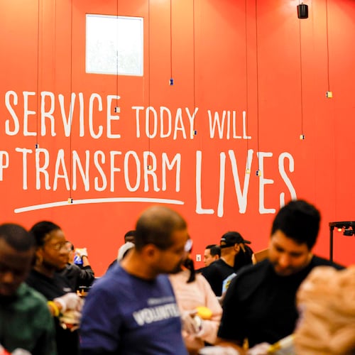 Volunteers are seen packing food at the Hunger Action Center at the Atlanta Community Food Bank Distribution Center on Wednesday, October 29, 2025. (Miguel Martinez/AJC)