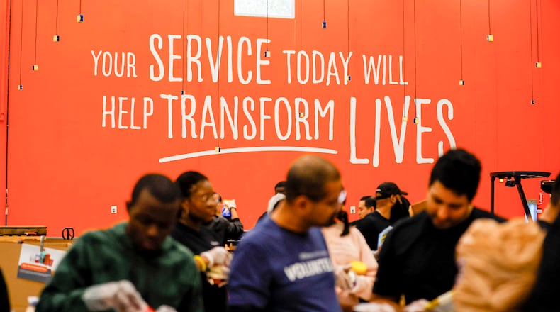 Volunteers are seen packing food at the Hunger Action Center at the Atlanta Community Food Bank Distribution Center on Wednesday, October 29, 2025. (Miguel Martinez/AJC)