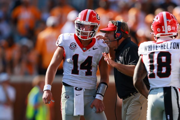 Georgia head coach Kirby Smart gives quarterback Gunner Stockton a play during the final minutes of play against the Tennessee Volunteers at Neyland Stadium on Saturday, Sept. 13, 2025, in Knoxville, Tenn. (Jason Getz/AJC)