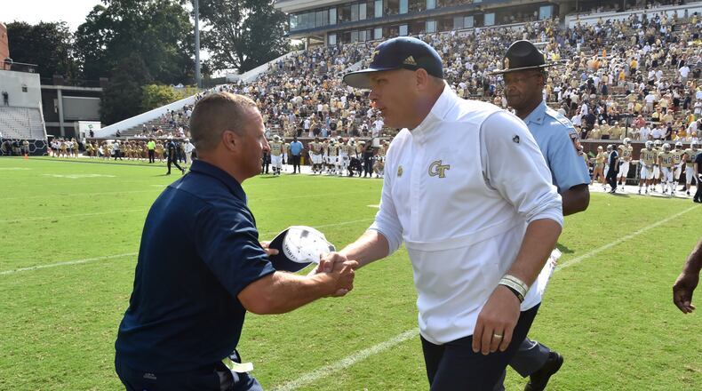 Citadel head coach Brent Thompson and Georgia Tech head coach Geoff Collins shake hands after Citadel won 27-24. (Hyosub Shin / Hyosub.Shin@ajc.com)