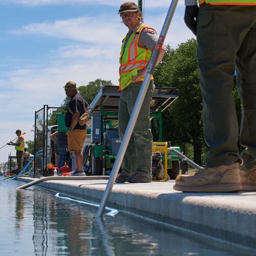 Members of the National Park Service clean the Lincoln Memorial Reflecting Pool of algae, Tuesday, June 16, 2026, in Washington. (AP Photo/Jacquelyn Martin)