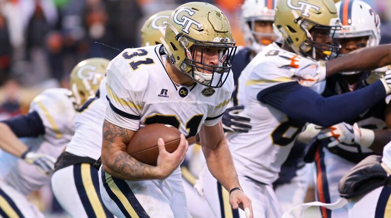 CHARLOTTESVILLE, VA - NOVEMBER 4: Nathan Cottrell #31 of the Georgia Tech Yellow Jackets rushes with the ball in the third quarter during a game against the Virginia Cavaliers at Scott Stadium on November 4, 2017 in Charlottesville, Virginia. Virginia defeated Georgia Tech 40-36. (Photo by Ryan M. Kelly/Getty Images)