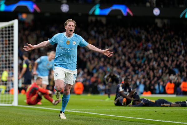 FILE - Manchester City's Kevin De Bruyne celebrates after scoring his side's opening goal during the Champions League quarterfinal second leg soccer match between Manchester City and Real Madrid at the Etihad Stadium in Manchester, England, Wednesday, April 17, 2024. (AP Photo/Dave Shopland, file)