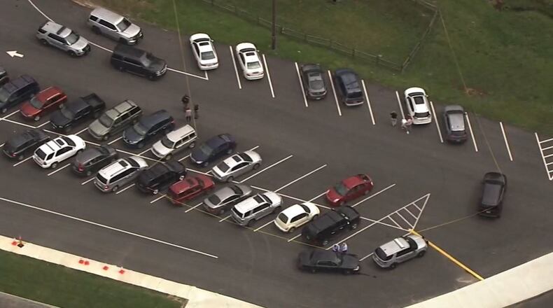 A woman was shot outside Beaverbrook Elementary School in Spalding County on Monday afternoon.