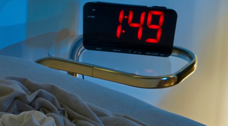 A bedroom clock next to an unmade bed, in Los Angeles, on Dec. 19, 2022. Research has found that sleep quality does indeed get a little rusty as you grow older, but it’s not a fate you have to live with, experts say. (Joyce Lee/The New York Times)
