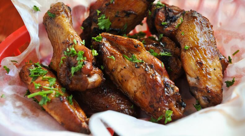 Smoke 'Em If Ya Got 'Em- 48 hour marinated wings, slow smoked, double dipped or naked from Bone Lick BBQ.