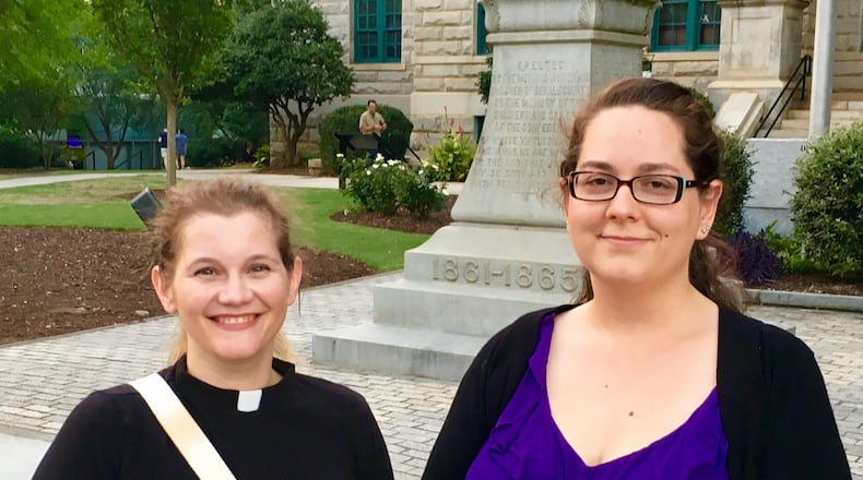 Hannah Hill (left) Sara Patenaude, stand in front of Decatur’s Confederate monument. A petition they started asking for the landmark’s removal now has 2,000 signatures. Bill Banks for the AJC