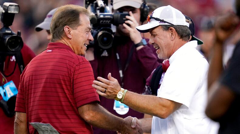 Happier times: Alabama head coach Nick Saban, left, and Texas A&M head coach Jimbo Fisher, right, shake hands during pre-game of an NCAA college football game on Saturday, Oct. 9, 2021, in College Station, Texas. (AP Photo/Sam Craft)