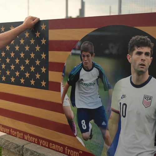 Pennsylvania Classic co-founder and president, Doug Harris, looks at a banner of U.S. national team soccer player, Christian Pulisic, who was born in nearby Hershey, and honed his skills at the club in Manheim, Pa., on Monday, June 29, 2026. (AP Photo/Luis Andres Henao)