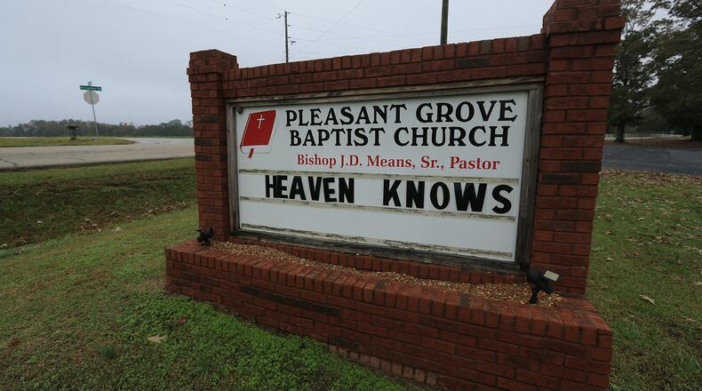 On Wednesday, Nov. 4, 2015, the Pleasant Grove Baptist Church sign reads “Heaven Knows” just 500 feet away from where the 2015 Dodge Journey of Donald and Crystal Howard left Broughton Road and crashed on Halloween. Curtis Compton / ccompton@ajc.com