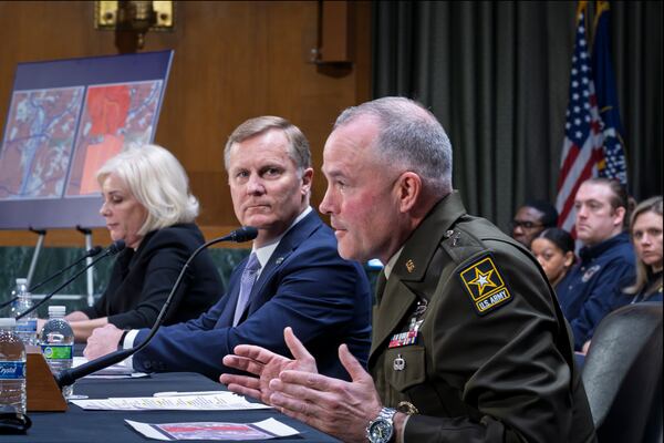 Brig. Gen. Matthew Braman, director of Army Aviation, center, answers questions, joined from left by Jennifer Homendy, chair of the National Transportation Safety Board, and Chris Rocheleau, acting administrator of the Federal Aviation Administration, as the Senate Transportation Subcommittee holds a hearing to examine the preliminary report by the National Transportation Safety Board on the Jan. 29, 2025, midair collision of an Army Black Hawk helicopter and an American Airlines regional jet, on Capitol Hill in Washington, Thursday, March 27, 2025. (AP Photo/J. Scott Applewhite)