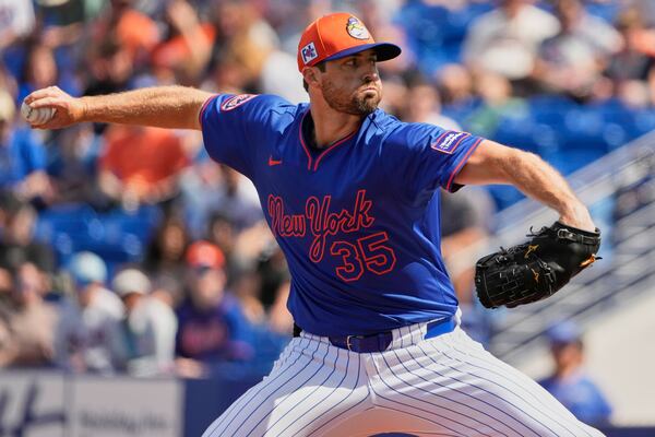 FILE - New York Mets starting pitcher Clay Holmes throws during the first inning of a spring training baseball game against the Houston Astros, Saturday, Feb. 22, 2025, in Port St. Lucie, Fla. (AP Photo/Jeff Roberson, File)
