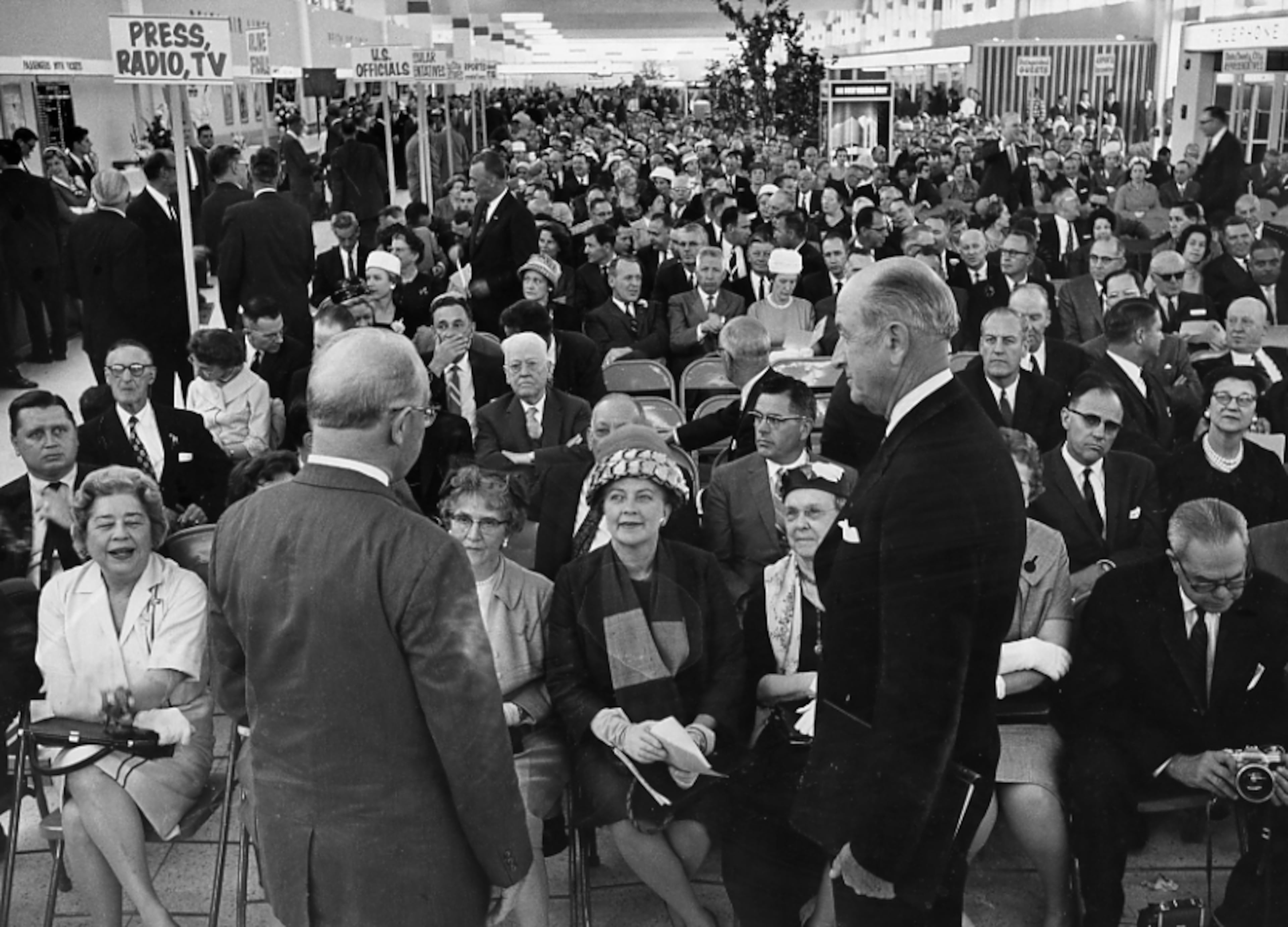 In 1961, crowds thronged the new Atlanta Airport terminal for its dedication ceremonies. Here, World Bank president Eugene Black and Atlanta Mayor William Hartsfield face an expectant audience. (Bill Wilson/AJC FILE)