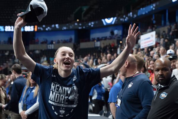 UConn guard Paige Bueckers celebrates as she leaves the court after a game against Southern California in the Elite Eight of the NCAA college basketball tournament Monday, March 31, 2025, in Spokane, Wash. (AP Photo/Jenny Kane)