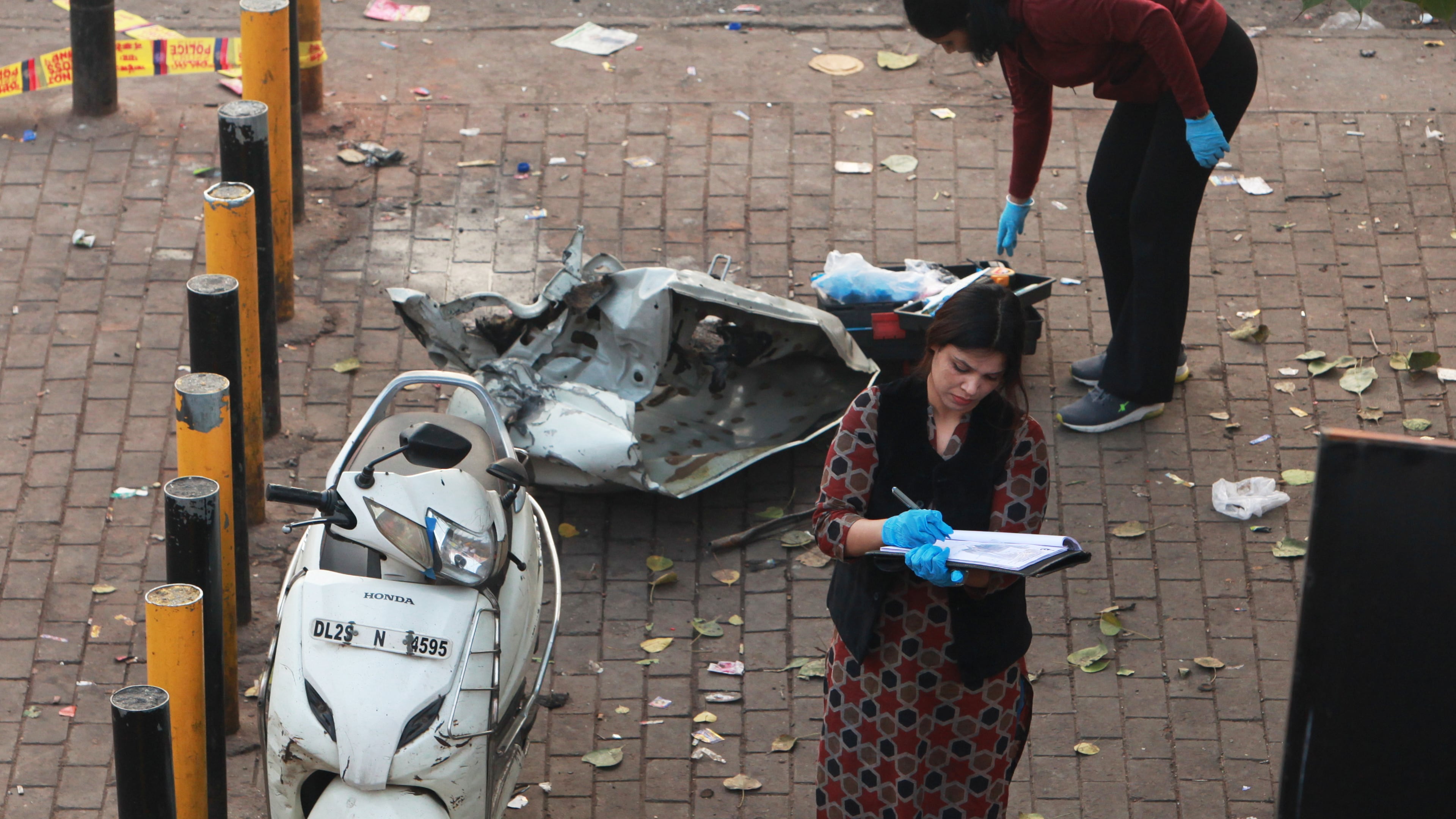 Investigators examine the site of Monday's car explosion near the historic Red Fort, in New Delhi, India, Tuesday, Nov. 11, 2025. (AP Photo)