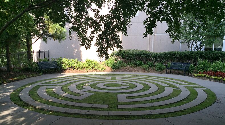A labyrinth invites visitors and patients near the entrance to Emory University Hospital at Midtown. The hospital has a number of quirky spaces for quiet reflection, including a giant sculptural wind chime and two aviaries. When it comes to designing Atlanta's hospitals and care centers, administrators know that environment matters. (PETE CORSON / pcorson@ajc.com)