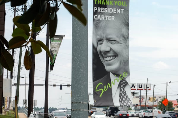 Views of Jimmy Carter banners along Jimmy Carter Boulevard in Norcross shown on Monday, May 22, 2023. (Natrice Miller/ natrice.miller@ajc.com)