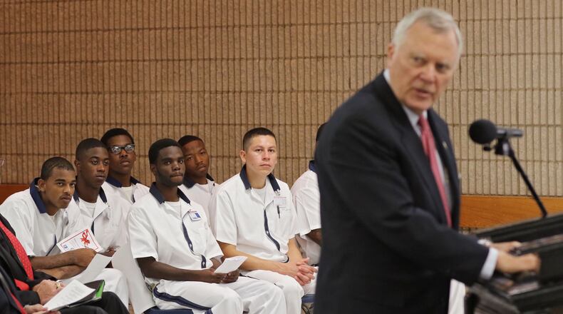 Inmate students listen to Gov. Nathan Deal's remarks during a ceremony to officially open the school. The first of what Gov. Nathan Deal envisions to be a statewide network of prison-based charter schools officially opened Thursday at the Burruss Correctional Institute in middle Georgia. Deal was on hand for the opening of the Foothills Education Charter School. BOB ANDRES / BANDRES@AJC.COM