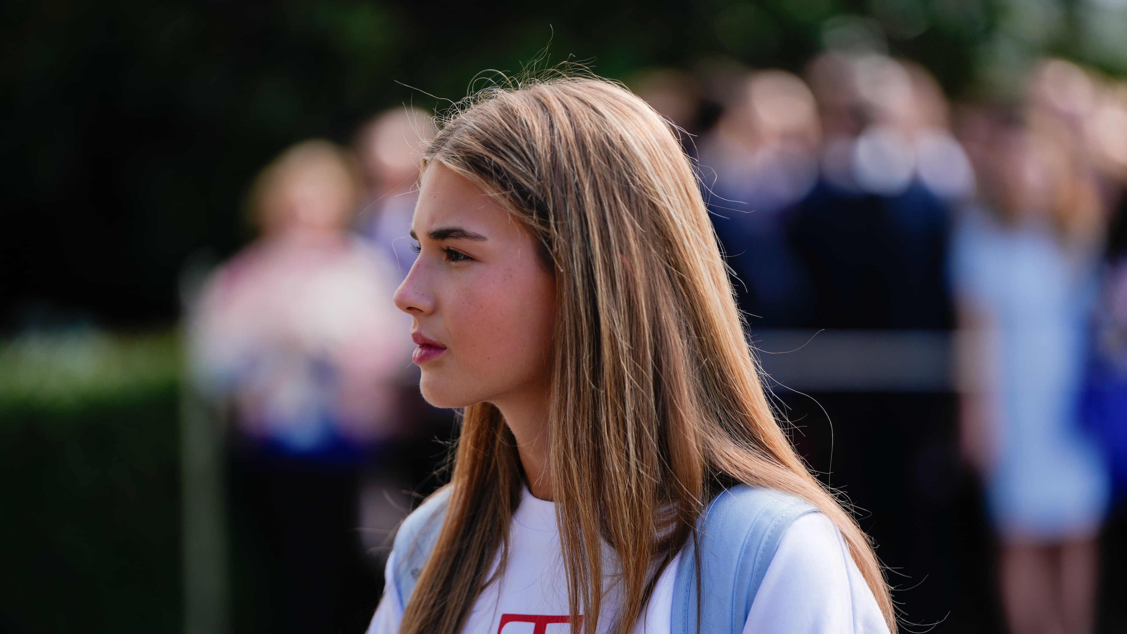 FILE - Kai Trump watches as her grandfather President Donald Trump speaks to reporters before departing the White House, Sept. 26, 2025, in Washington. (AP Photo/Julia Demaree Nikhinson, file)