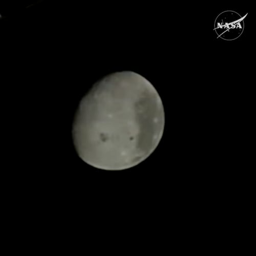 In this image from video provided by NASA, the Moon is seen from a camera outside the Orion Spacecraft after the Artemis II astronauts surpassed the farthest distance ever traveled by humans from Earth, Monday, April 6, 2026. (NASA via AP)