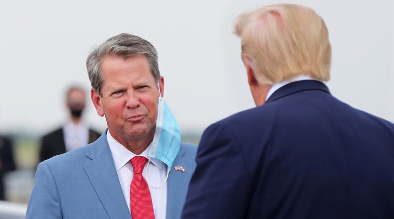 Georgia Governor Brian Kemp greets President Donald Trump as he visits Georgia to talk about an infrastructure overhaul at the UPS Hapeville hub at Hartsfield-Jackson International Airport on Wednesday July 15, 2020 in Atlanta. Curtis Compton ccompton@ajc.com