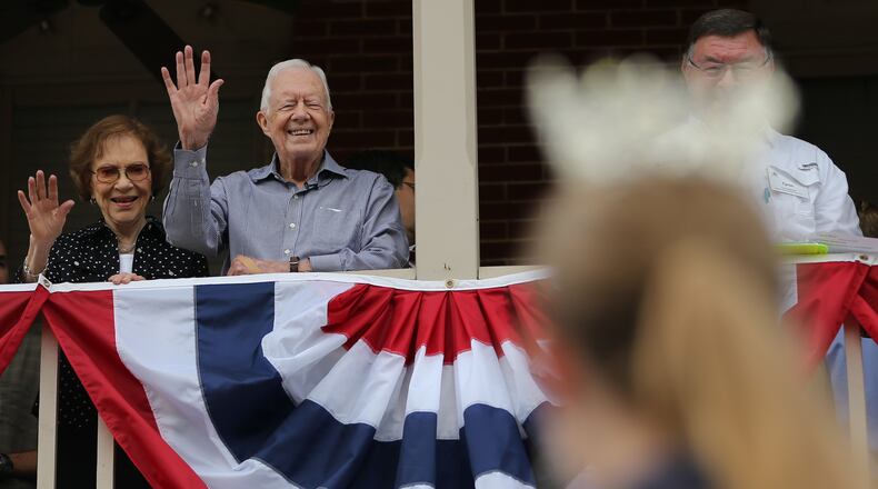 It’s been a busy few days for former President Jimmy Carter, who turns 91 today. This past Saturday, he was out and about at the annual Plains Festival, including watching the parade with his wife, Rosalynn , from the balcony of the Plains Inn. Ben Gray / bgray@ajc.com