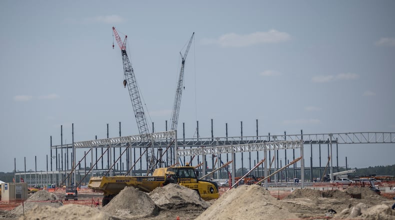 ELLABELL, GA. - JUNE 5, 2023: Large cranes and heavy earth-moving equipment work a construction site at the Hyundai Metaplant site, Monday, July 5, 2023, in Ellabell, Ga. (AJC Photo/Stephen B. Morton)