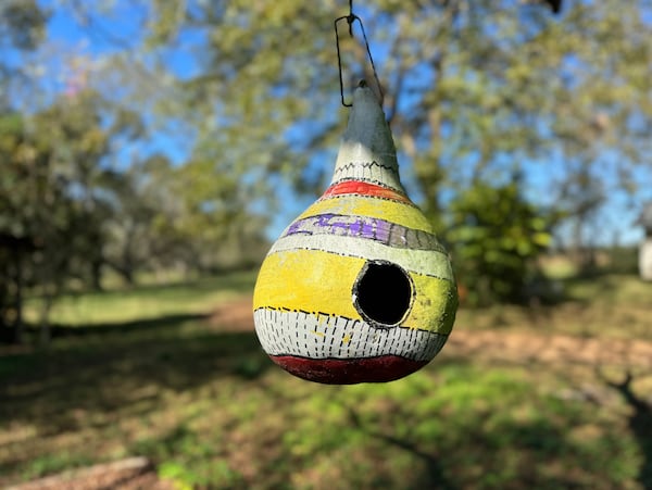 A gourd birdhouse hangs at Koinonia Farm south of Americus. Established in 1942 by Clarence Jordan, Koinonia Farm was envisioned as a place where residents could live out their faith by welcoming people of all races, sharing possessions and staying committed to nonviolence. (Joe Kovac Jr./AJC)