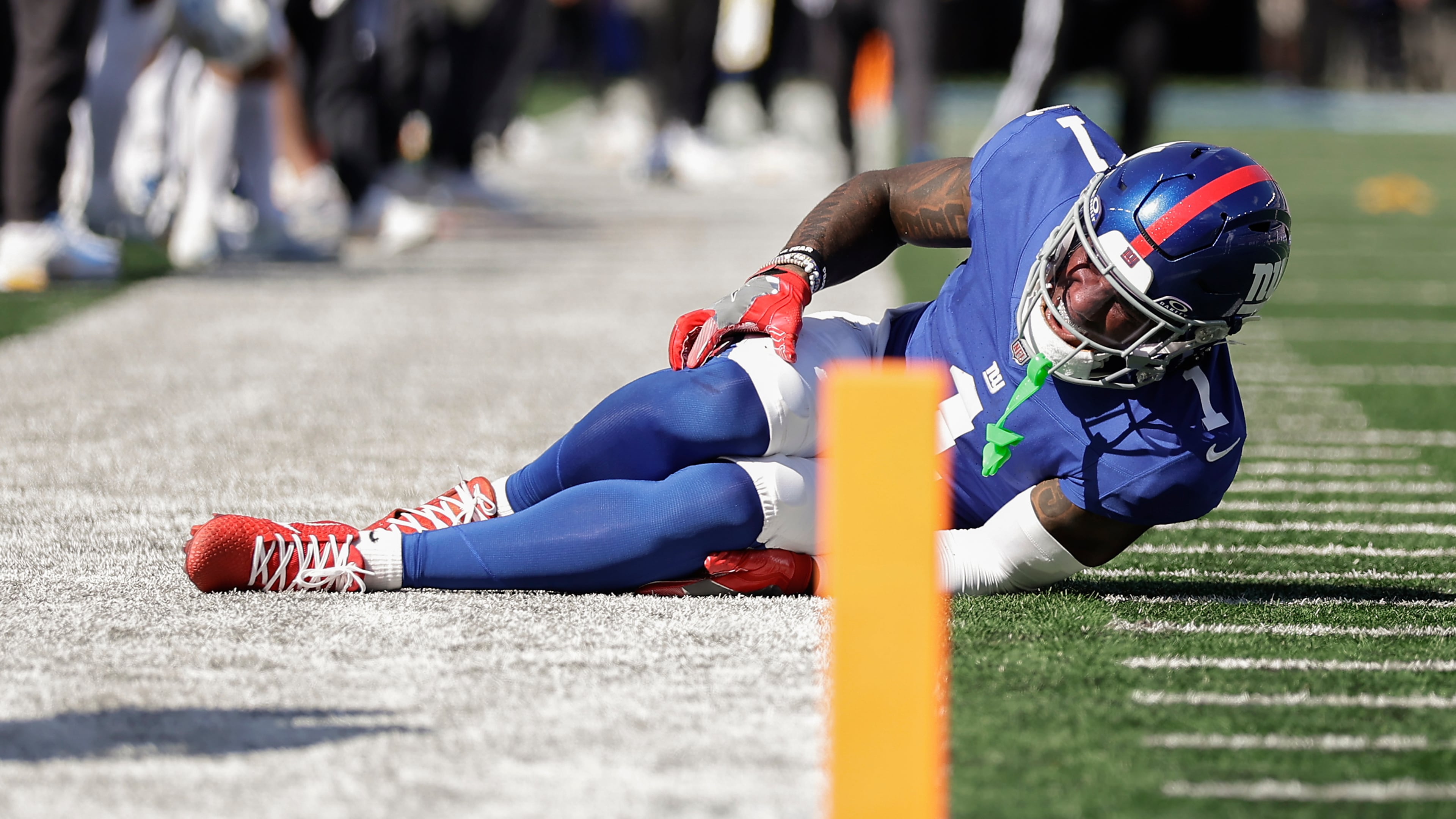 New York Giants wide receiver Malik Nabers (1) reacts to an injury during the second quarter of an NFL football game against the Los Angeles Chargers, Sunday, Sept. 28, 2025, in East Rutherford, N.J. (AP Photo/Adam Hunger)