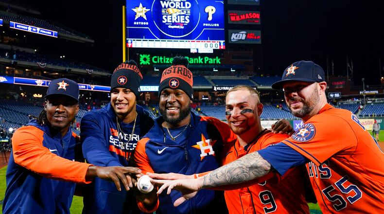 Houston Astross relief pitcher Rafael Montero, relief pitcher Bryan Abreu, starting pitcher Cristian Javier, catcher Christian Vazquez, and relief pitcher Ryan Pressly, from left, celebrate a combined no hitter after Game 4 of baseball's World Series between the Houston Astros and the Philadelphia Phillies on Wednesday, Nov. 2, 2022, in Philadelphia. The Astros won 5-0 to tie the series two games all. (AP Photo/Matt Slocum)