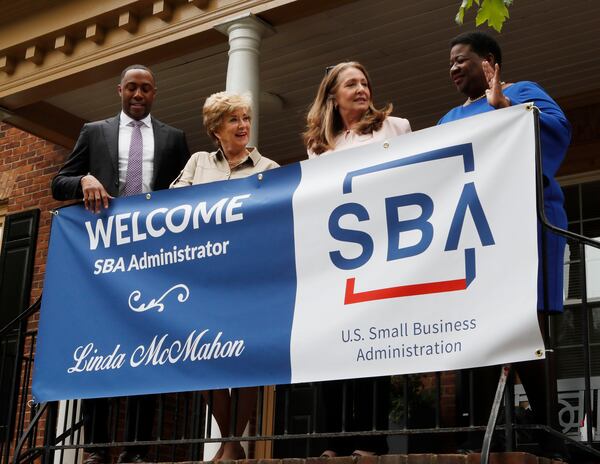 Ashley Bell (from left), Region 4 Administrator,  Linda McMahon, SBA Administrator, Catherine Downey, owner of CATMEDIA, and Terri Denison, District Director, SBA Georgia district office, as they gather for a photo in front of CATMEDIA. (Bob Andres/AJC)