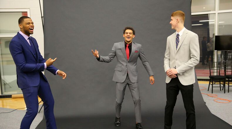 Hawks top draft pick Trae Young is at the center of a light-hearted photo shoot in Atlanta with fellow picks Omari Spellman, left, and Kevin Huerter.