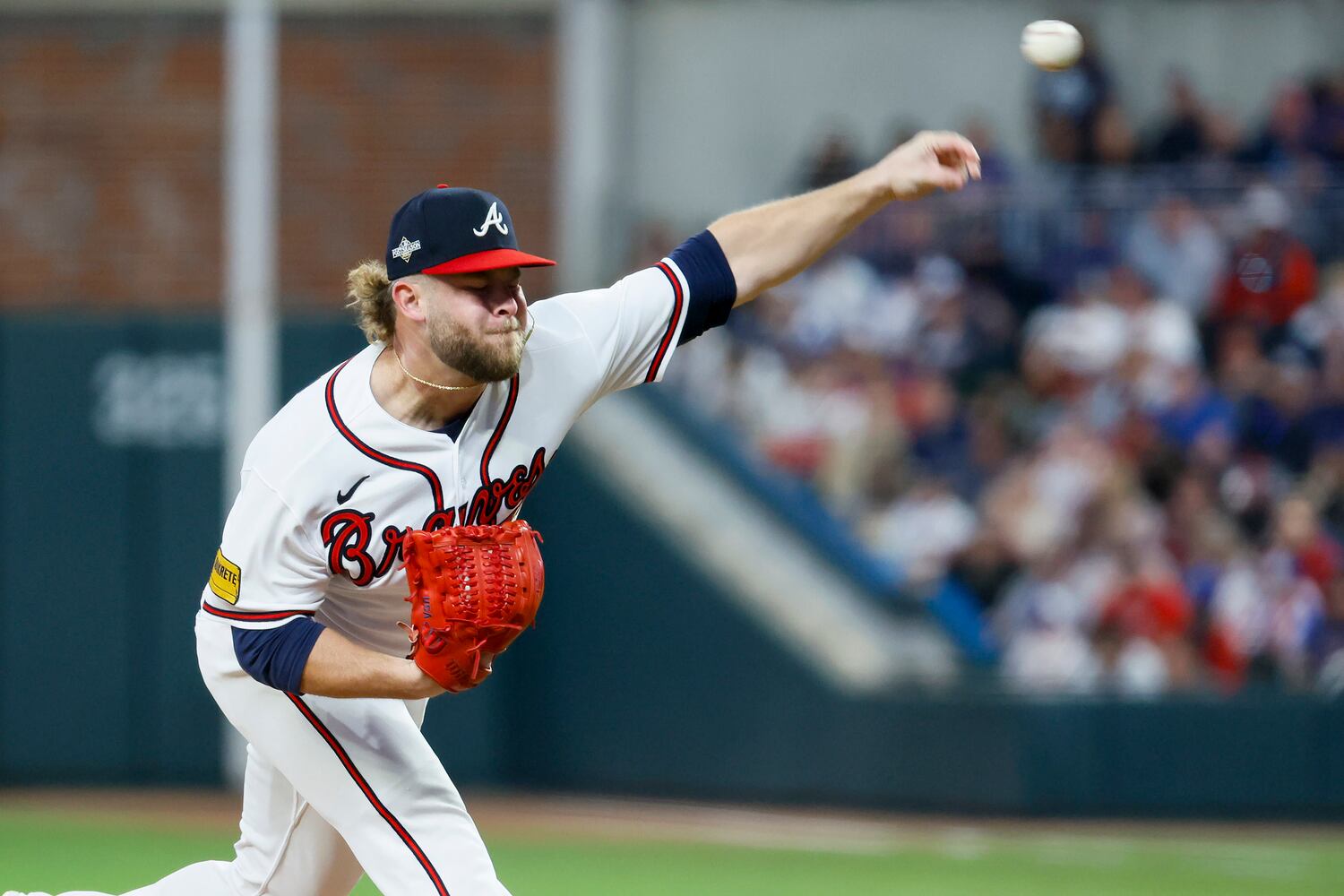 Atlanta Braves relief pitcher A.J. Minter (33) delivers to the Philadelphia Phillies during the eighth inning of NLDS Game 2 in Atlanta on Monday, Oct. 9, 2023.   (Miguel Martinez / Miguel.Martinezjimenez@ajc.com)