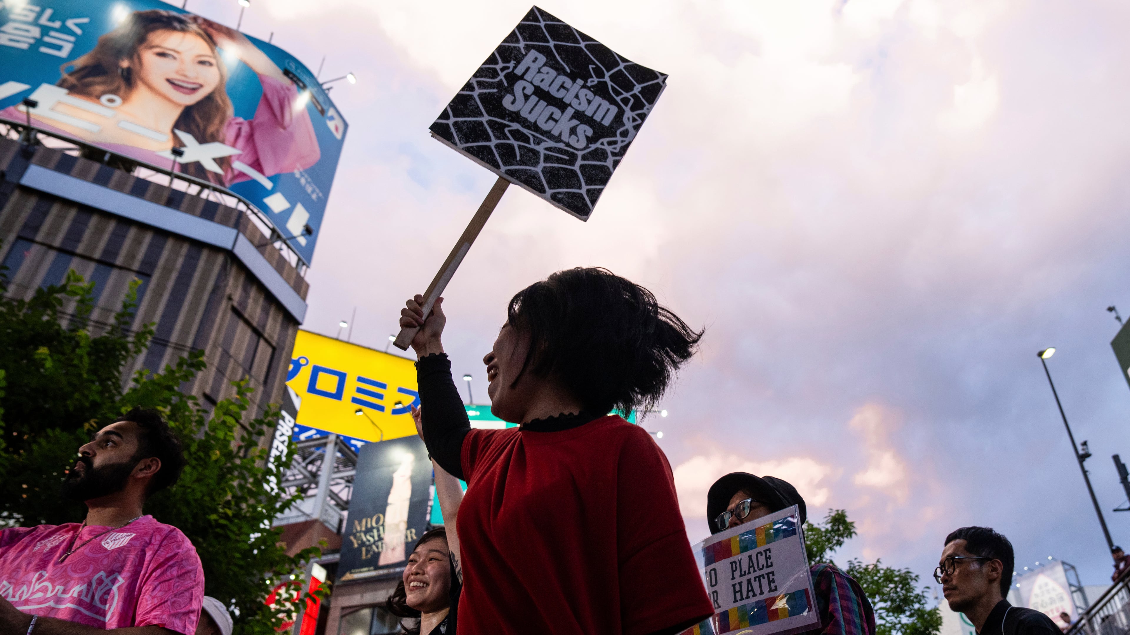 FILE - Demonstrators take part in a 'protest rave' against racism and nationalist party Sanseito ahead of the upper house election in the Shinkuku district of Tokyo, on July 13, 2025. (AP Photo/Louise Delmotte, File)