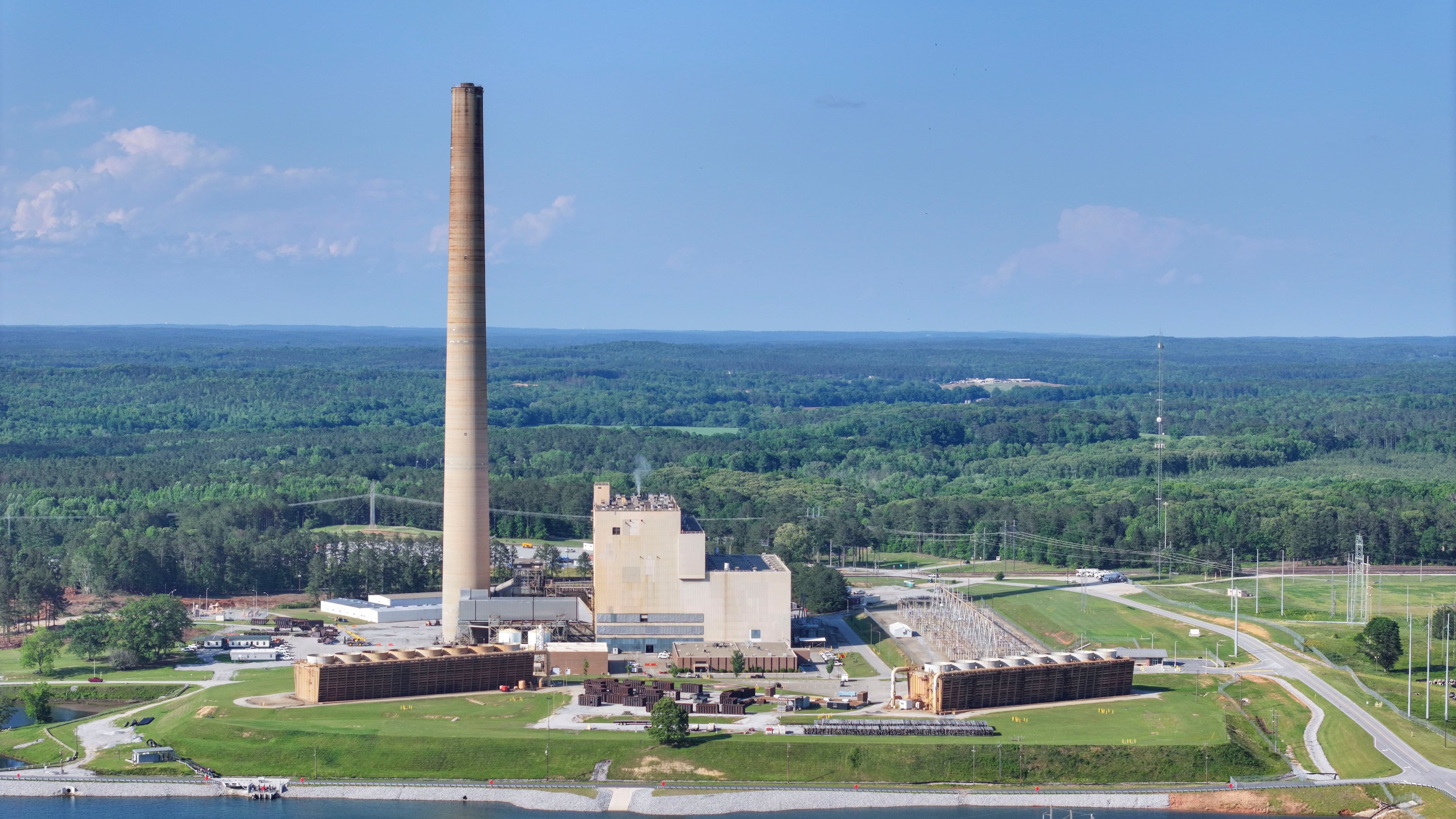 A drone image taken on Thursday, May 8, 2025, shows the Yates Power Plant in Newnan, Georgia. The plant has caught the attention of developers who want to build a large data center nearby, covering 4.9 million square feet. This proposed site is close to a big wooded area, and some local residents have shared their worries about the project.
(Miguel Martinez/ AJC)