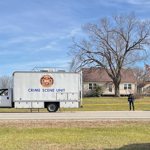 This photo provided by the Kansas Bureau of Investigation shows a crime scene truck parked in front of the home where a domestic violence incident resulted in multiple casualties, Saturday, Nov. 15, 2025, in Carbondale, Kan. (Kansas Bureau of Investigation via AP)
