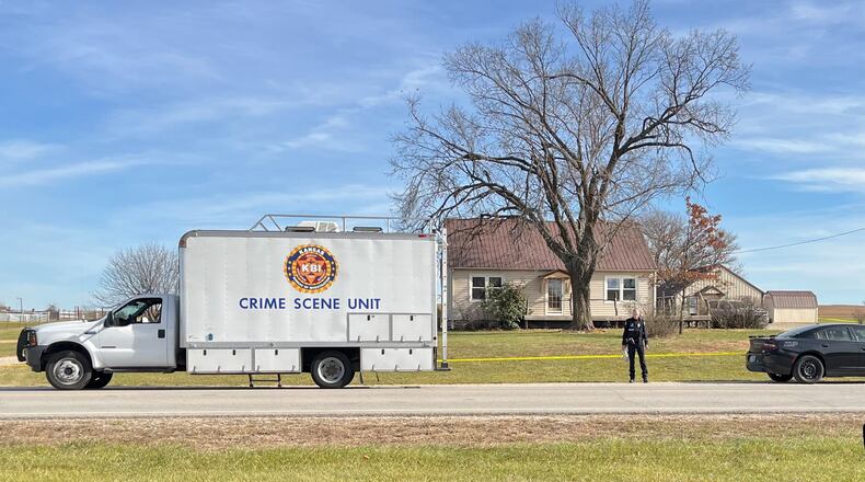 This photo provided by the Kansas Bureau of Investigation shows a crime scene truck parked in front of the home where a domestic violence incident resulted in multiple casualties, Saturday, Nov. 15, 2025, in Carbondale, Kan. (Kansas Bureau of Investigation via AP)