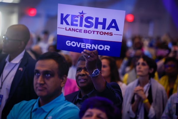 Attendees hold signs for Democratic gubernatorial candidate Keisha Lance Bottoms at the Georgia Democratic Convention at the Savannah Convention Center in Savannah on Saturday, Aug. 1, 2026. (Arvin Temkar/AJC)