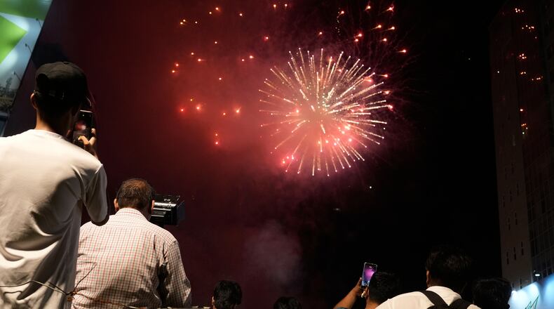 People watch fireworks in Lahore, Pakistan, Saturday, Aug. 8, 2026, during celebrations of the signing a trilateral defense agreement between Saudi Arabia, Pakistan and Turkey in Mecca. (AP Photo/K.M. Chaudary)