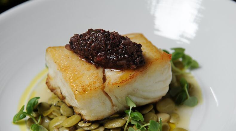 Sauteed North Ern Halibut with nicoise olive tapenade, local butter beans from Article 14. (BECKY STEIN)