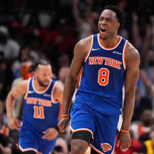 New York Knicks forward Og Anunoby (8) reacts after scoring during the first half of Game 4 in a first-round NBA playoffs basketball series against the Atlanta Hawks Saturday, April 25, 2026, in Atlanta. (AP Photo/Brynn Anderson)