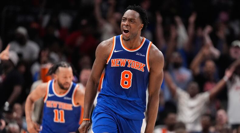 New York Knicks forward Og Anunoby (8) reacts after scoring during the first half of Game 4 in a first-round NBA playoffs basketball series against the Atlanta Hawks Saturday, April 25, 2026, in Atlanta. (AP Photo/Brynn Anderson)